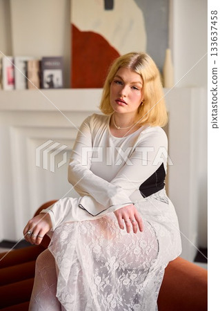Fashionfocused portrait showcasing refined lace attire and mood 133637458