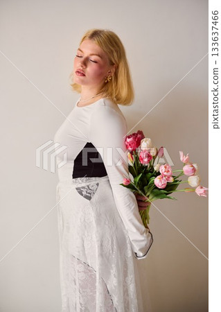 Blonde woman quietly reflective, Caucasian lady with floral Blonde woman quietly reflective, Caucasian lady with floral 133637466