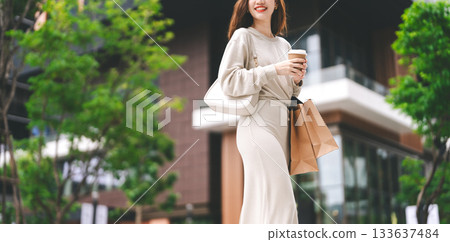 Single adult asian woman holding take away coffee cup and shopping bag city people lifestyle Single adult asian woman holding take away coffee cup and shopping bag city people lifestyle 133637484