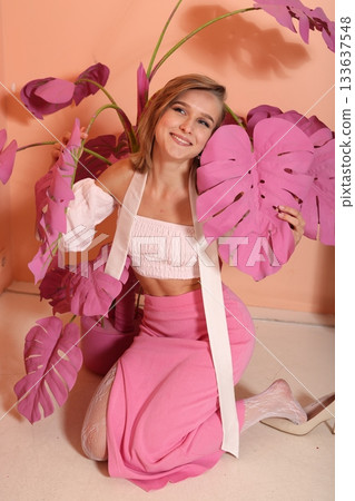 Closeup of creator showcasing makeup with greenery background Closeup of creator showcasing makeup with greenery background 133637548