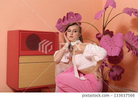 Chic influencer showcasing classic style with pastel illumination Chic influencer showcasing classic style with pastel illumination 133637566