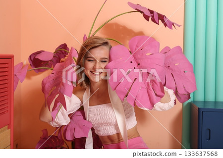 Joyful female model highlighting makeup artistry and skincare Joyful female model highlighting makeup artistry and skincare 133637568