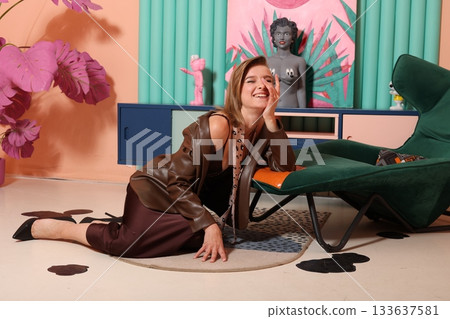 Lifestyle stylist portrait - smiling woman in retro studio 133637581
