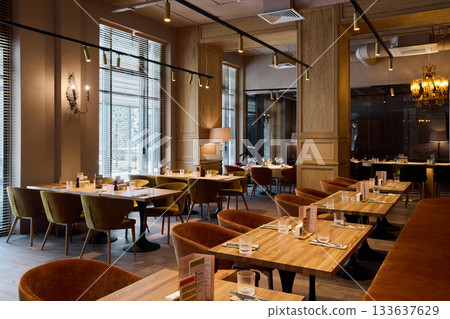 comfortable space with refined details, open restaurant space with ambient lighting and sophisticated decor comfortable space with refined details, open restaurant space with ambient lighting and sophisticated decor 133637629