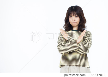 Woman with her arms crossed Woman with her arms crossed 133637819