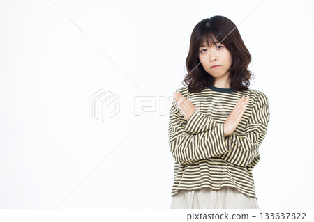 Woman with her arms crossed Woman with her arms crossed 133637822