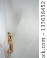 Beauty woman with angel wings in a studio setting 133638452