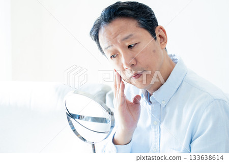 Middle-aged men who care about their hair Middle-aged men who care about their hair 133638614