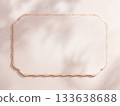 Blank Vintage Paper Card Mockup with Elegant Gold Border, Aesthetic Sunlight Shadows on Beige Texture Background, Copy Space for Wedding Invitation or Menu Design. 133638688