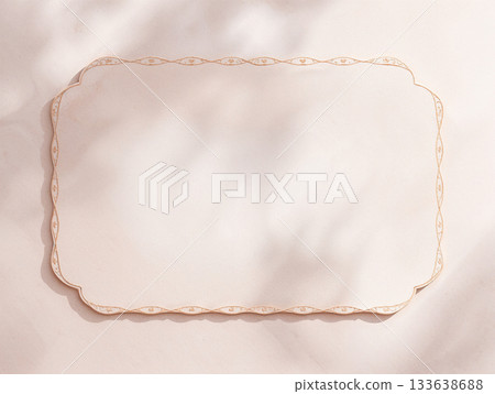 Blank Vintage Paper Card Mockup with Elegant Gold Border, Aesthetic Sunlight Shadows on Beige Texture Background, Copy Space for Wedding Invitation or Menu Design. 133638688