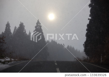 Winter sun and snowy national highway 133639326