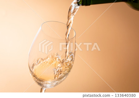 Pour white wine 133640380