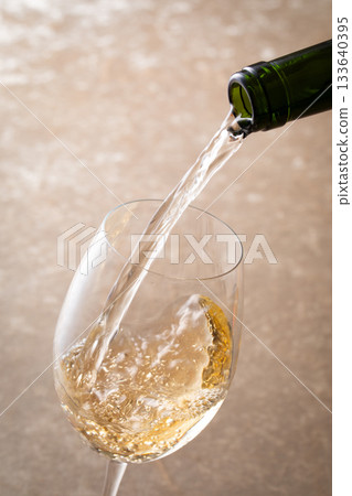 Pour white wine 133640395