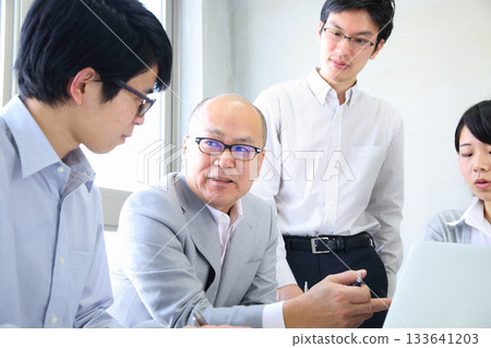 Young employees and managers holding a planning meeting at the company 133641203