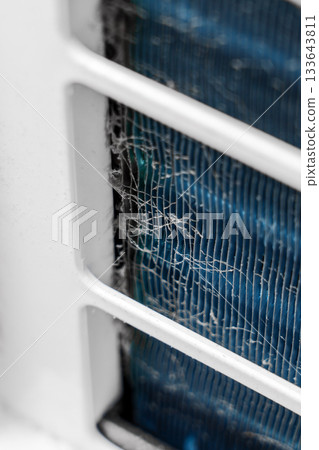 Macro shot of dust on the air conditioner vent grille Macro shot of dust on the air conditioner vent grille 133643811