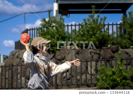 <Material> A woman playing catch in the park 133644116