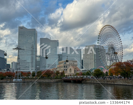Ferris wheel and Minato Mirai buildings over the water (Autumn) 2025.11 Yokohama, Japan 133644174