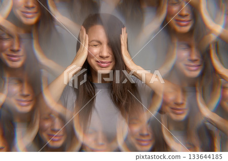 Stressed woman with eyes closed pressing temples showing migraine or headache Stressed woman with eyes closed pressing temples showing migraine or headache 133644185