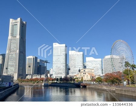 Yokohama Landmark Tower seen over the water under a clear blue sky, November 2025, Yokohama, Japan 133644336