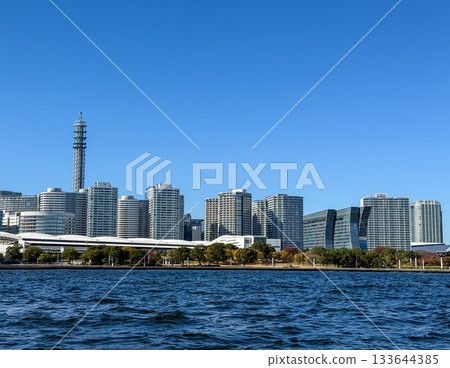 The Yokohama Minato Mirai skyline seen across the clear blue sea, November 2025, Yokohama, Japan The Yokohama Minato Mirai skyline seen across the clear blue sea, November 2025, Yokohama, Japan 133644385