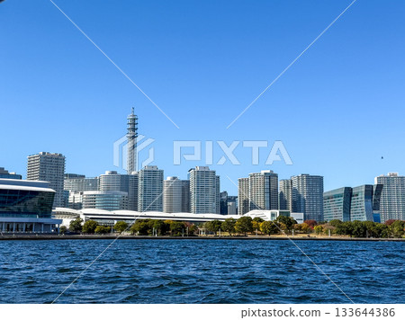 The Yokohama Minato Mirai skyline seen across the clear blue sea, November 2025, Yokohama, Japan The Yokohama Minato Mirai skyline seen across the clear blue sea, November 2025, Yokohama, Japan 133644386