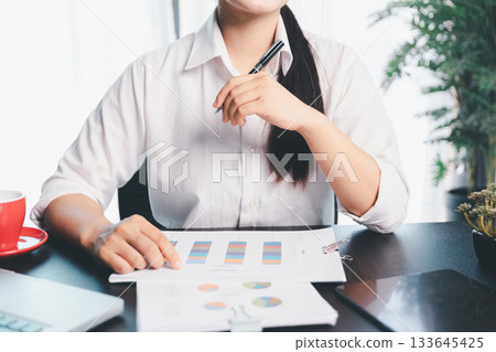 Business woman analyze calculate company financial, tax results office accounting statistics analytical research. calculating business balance prepare tax reduction. Tax deduction planning concept. Business woman analyze calculate company financial, tax results office accounting statistics analytical research. calculating business balance prepare tax reduction. Tax deduction planning concept. 133645425