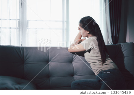 Sorrowful woman sat alone, overwhelmed by emotion, her sad and unhappy expression revealing deep despair, stress and distress left feeling depressed. sorrowful sad, despair alone, depressed stress Sorrowful woman sat alone, overwhelmed by emotion, her sad and unhappy expression revealing deep despair, stress and distress left feeling depressed. sorrowful sad, despair alone, depressed stress 133645429