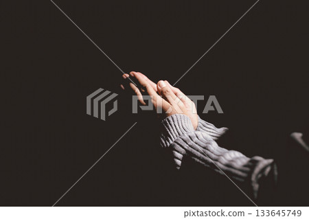 Person holding hands together in prayer gesture, symbolizing hope, faith, meditation, spirituality, trust, belief, peace, devotion, inner strength and resilience during hard times. Person holding hands together in prayer gesture, symbolizing hope, faith, meditation, spirituality, trust, belief, peace, devotion, inner strength and resilience during hard times. 133645749