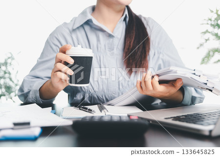 Business woman analyze calculate company financial, tax results office accounting statistics analytical research. calculating business balance prepare tax reduction. Tax deduction planning concept. 133645825