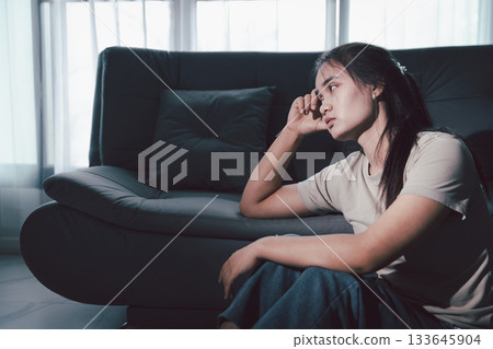 Sorrowful woman sat alone, overwhelmed by emotion, her sad and unhappy expression revealing deep despair, stress and distress left feeling depressed. sorrowful sad, despair alone, depressed stress Sorrowful woman sat alone, overwhelmed by emotion, her sad and unhappy expression revealing deep despair, stress and distress left feeling depressed. sorrowful sad, despair alone, depressed stress 133645904