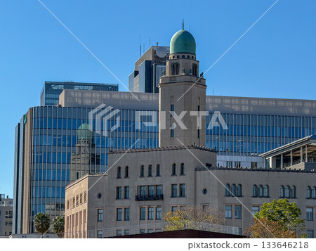 Close-up of Yokohama Customs (Queen's Tower) with a modern building in the background. November 2025, Yokohama, Japan. Close-up of Yokohama Customs (Queen's Tower) with a modern building in the background. November 2025, Yokohama, Japan. 133646218