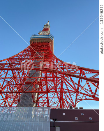 A powerful low-angle shot of Tokyo Tower piercing the blue sky, November 2025, Minato Ward, Japan 133646253