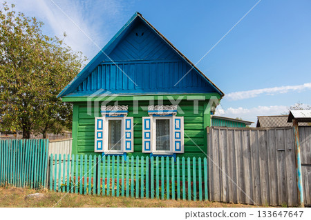 One-story Russian village house with carved shutters. One-story Russian village house with carved shutters. 133647647