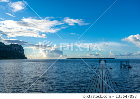 Sunset over the tranquil lagoon of Maupiti, French Polynesia Sunset over the tranquil lagoon of Maupiti, French Polynesia 133647858