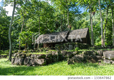 Thatched-roof building at Kamuihei archaeological site, Nuku Hiva, Marquesas Islands. French Polynesia Thatched-roof building at Kamuihei archaeological site, Nuku Hiva, Marquesas Islands. French Polynesia 133647862