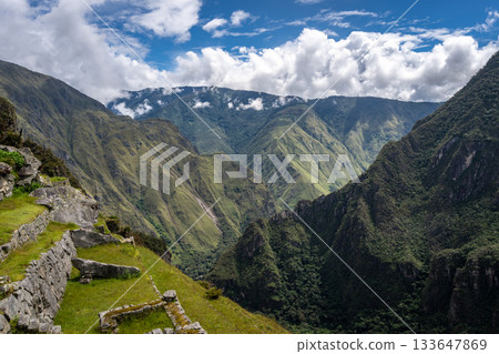 Panoramic view of Machu Picchu ruins with Huayna Picchu in background, Peru Panoramic view of Machu Picchu ruins with Huayna Picchu in background, Peru 133647869