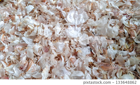 Layered Dry Garlic Skins Pattern. Bright Close-up Background of Organic Allium Sativum Husks Layered Dry Garlic Skins Pattern. Bright Close-up Background of Organic Allium Sativum Husks 133648862
