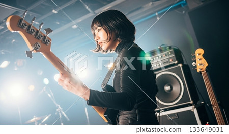 A woman playing the base 133649031