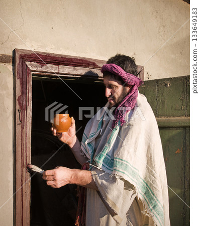 Man painting door with blood 133649183
