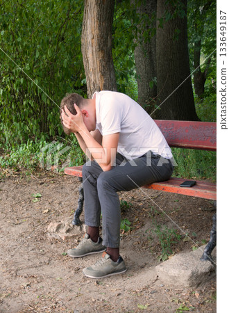 Sad guy on the park bench Sad guy on the park bench 133649187