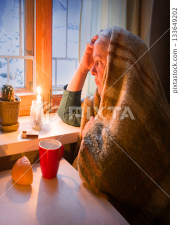 Poor old lady at the window 133649202