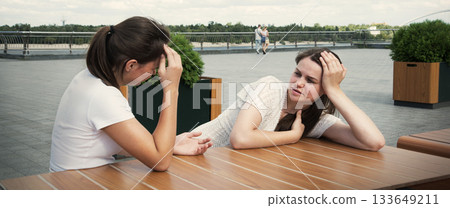 Young girls in a cafe Young girls in a cafe 133649211