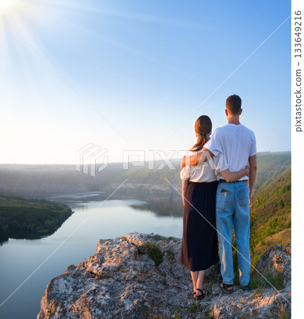 Girl and guy on the hill Girl and guy on the hill 133649216