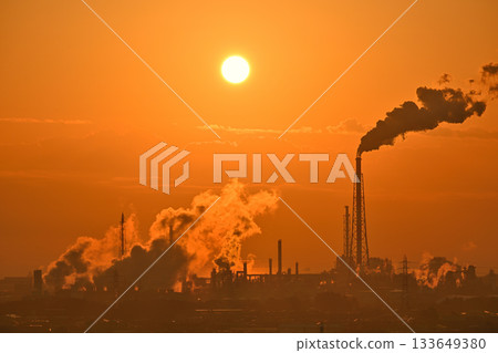Sun rising from the factory 133649380