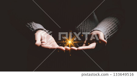 Hands holding glowing light, symbolizing hope, healing, faith, inspiration, spiritual energy, new beginning, miracle, inner strength and positive transformation from darkness to light. Hands holding glowing light, symbolizing hope, healing, faith, inspiration, spiritual energy, new beginning, miracle, inner strength and positive transformation from darkness to light. 133649516