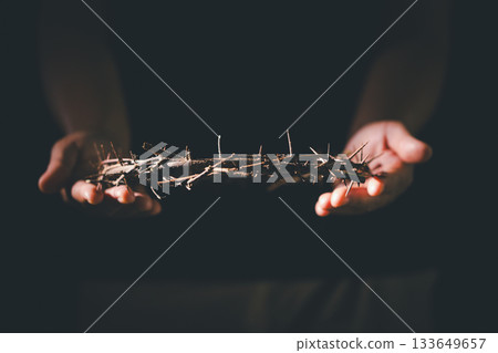 Closeup of Jesus Christ wearing crown of thorns during His crucifixion captures the suffering, sacrifice, and deep spirituality that define Easter and the core of Christian faith and religion. 133649657