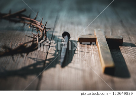 Crucifixion of Jesus Christ, nail-pierced hands, crown of thorns, cross, symbol of Christianity, representing holy sacrifice, passion, faith central to Easter celebration, religious tradition. 133649889