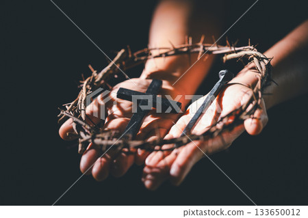 Closeup of Jesus Christ wearing crown of thorns during His crucifixion captures the suffering, sacrifice, and deep spirituality that define Easter and the core of Christian faith and religion. Closeup of Jesus Christ wearing crown of thorns during His crucifixion captures the suffering, sacrifice, and deep spirituality that define Easter and the core of Christian faith and religion. 133650012