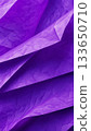 Purple crumpled paper texture with layered folds and light shadows, abstract background for design and creative projects. 133650710
