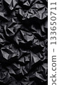 Black crumpled paper texture with deep folds and sharp shadows, abstract dark surface for background and graphic design projects. 133650711